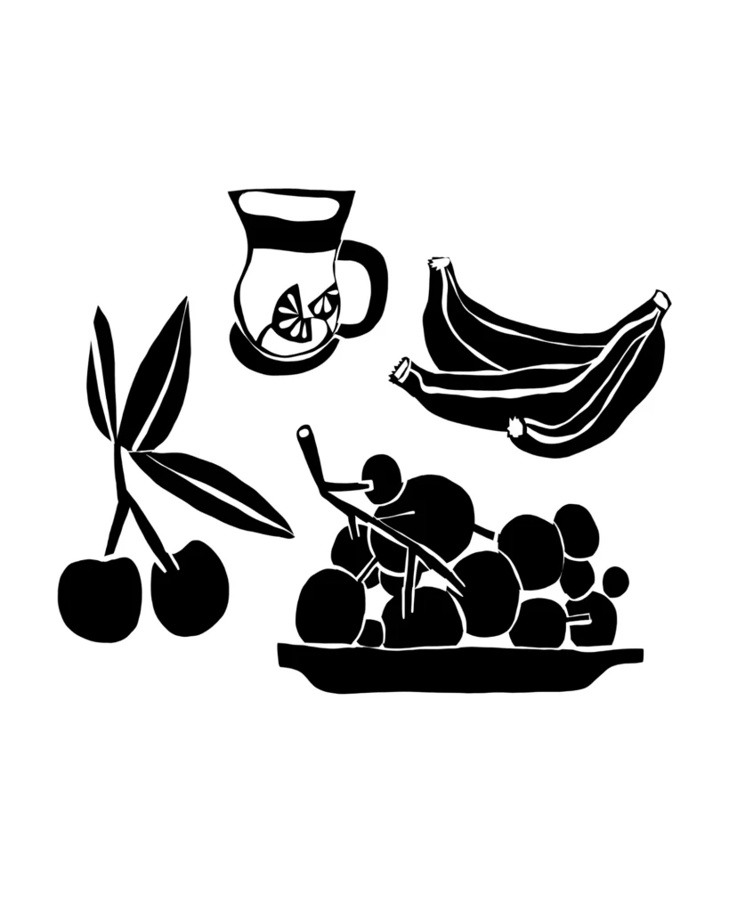 Paper cut illustration of a glass of tea, bananas, cherries and a bowl of fruit