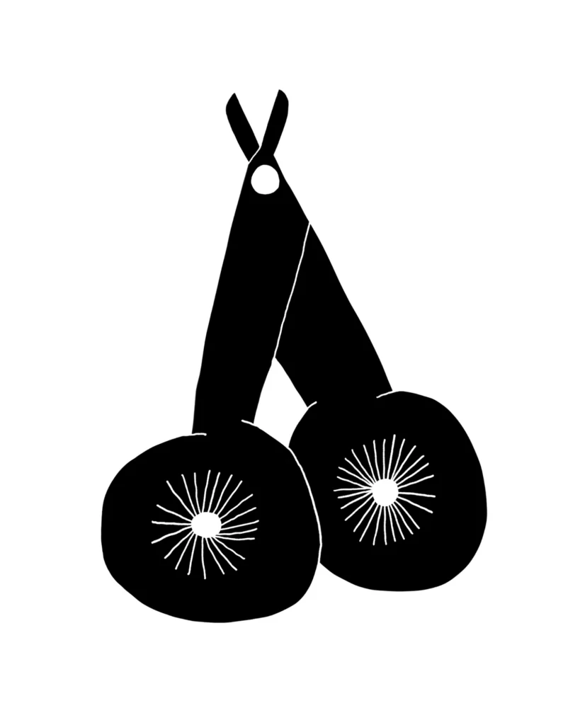 Paper cut illustration of scissors and two kiwi halves